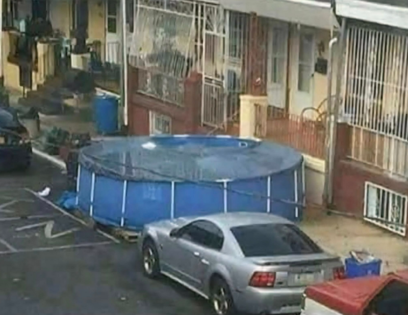 This is any property owner/manager’s nightmare, but rather comical if it wasn’t so absurd. Anyone care to take a dip? 🏊‍♀️---Meanwhile in Philly Y’all out here buying $600k houses with saltwater infinity pools and meanwhile someone on Lehigh Ave just turned a handicapped parking spot into a full-blown above-ground Olympic training center using 3 pallets and a Dollar General tarp.This ain’t just a pool. This is a statement. This is “you said I can’t? WATCH ME.”This is North Philly engineering, baby. No HOA. No permits. Just vibes and hose water.And don’t worry about parking,the Mustang’s already blocking two spots and the chlorine’s probably gonna dissolve the curb anyway.You haven’t truly lived until you’ve cannonballed into a pool that might be covering a manhole. Philly forever.